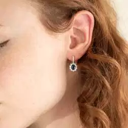 Photo of worn Kate Blue Sapphire Earrings 7x5mm and 32 Diamonds