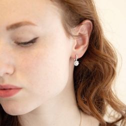 Photo of worn Earrings Lever Closure Flower Solitaire 0.17ct contoured