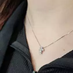 Photo of worn Necklace with 6 diamonds cross - width 6.7mm