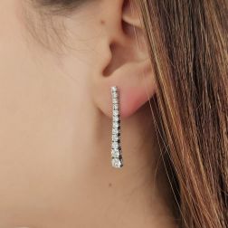 Photo of worn Scalar Tennis Earrings 3 cm with 24 Diamonds