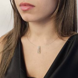 photo of worn Trapeze Pendant Necklace with two Golds and 27 Diamonds