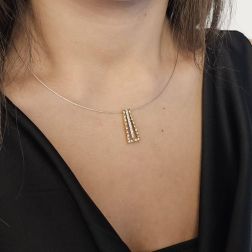 photo of worn Trapeze Pendant Necklace with two Golds and 27 Diamonds