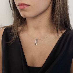 Photo of worn Oval Pendant Necklace in White and Yellow Gold with 23 Diamonds