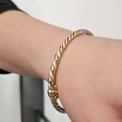 Photo of worn Polished and Satin Braided Rigid Bracelet in Yellow Gold