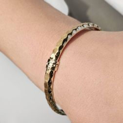 Photo of worn Hammered Satin and Polished Bracelet in Yellow Gold