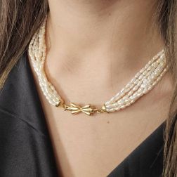 Photo of worn Strand Necklace with Oval Pearls and Bow attachment in Yellow Gold