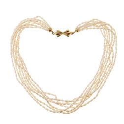 Strand Necklace with Oval Pearls and Bow attachment in Yellow Gold