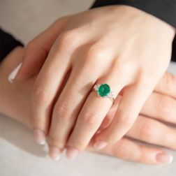 Photo of worn Solitaire Ring with Oval-cut Emerald and Diamonds