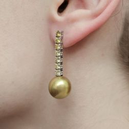 Photo of worn Pendant Earrings with Gold Pearl and Brown Diamonds