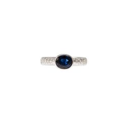 Solitaire ring surrounded by 1.324ct Blue Sapphire and Diamonds