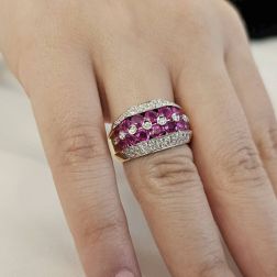 Photo of worn Banded design ring with 14 Pink Sapphires and 50 Diamonds
