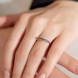 Photo of worn Veretta Ring 9 Blue Sapphires of 0.383ct in Rose Gold