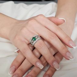 Photo of worn Pavè and Baguette Emerald and Diamond Design Ring