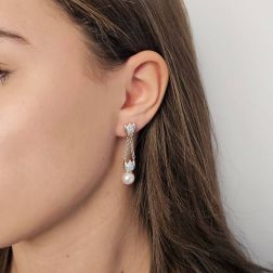 Photo of worn Chain earrings with Akoya Pearls and Diamonds in White and Yellow Gold