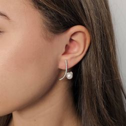Photo of worn Curved Pendant Earrings with Akoya Pearls and 50 Diamonds