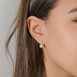 Photo of worn Scaled Circle Pearl and Diamond Earrings in White Gold