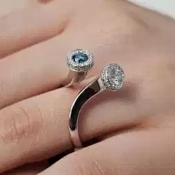Photo of worn White Diamonds and Blue Diamond Steli Ring in White Gold