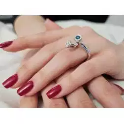 Photo of worn White Diamonds and Blue Diamond Steli Ring in White Gold
