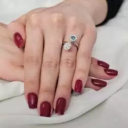 Photo of worn White Diamonds and Blue Diamond Steli Ring in White Gold