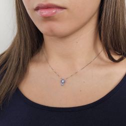 Photo of worn Blue sapphire cross necklace - Width 8.3mm