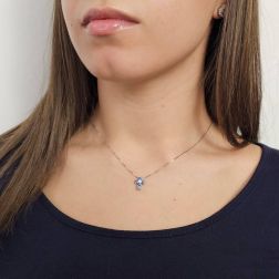 Photo of worn Blue sapphire cross necklace - Width 8.3mm
