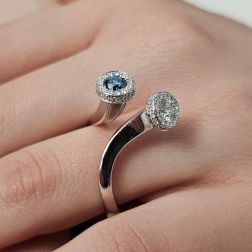 Photo of worn White Diamonds and Blue Diamond Steli Ring in White Gold
