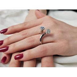 Photo of worn White Diamonds and Blue Diamond Steli Ring in White Gold
