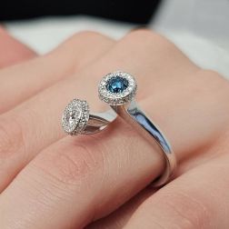 Photo of worn White Diamonds and Blue Diamond Steli Ring in White Gold