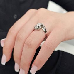 Photo of worn 0.76ct "Louvre" Double Diamond Platinum Surrounded Solitaire Ring