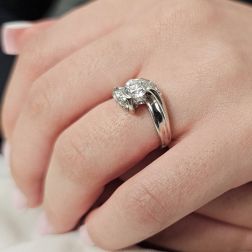 Photo of worn 0.76ct "Louvre" Double Diamond Platinum Surrounded Solitaire Ring