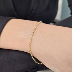Bracciale Palline Oro Giallo 2mm chiusura occhiello a molla foto indossata