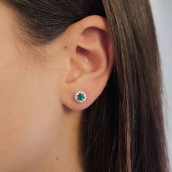 Photo of worn Point of Light Earrings with Emeralds and 28 Diamonds