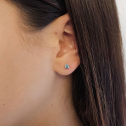 Photo of worn Classic Point of Light Earrings with Blue Diamonds 0,40ct