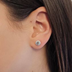 Photo of worn Point of Light Earrings with Aquamarine and 28 Diamonds