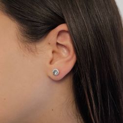 Photo of worn Point of Light Earrings with Aquamarine and 28 Diamonds