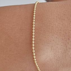Bracciale palline oro giallo 18.50cm x 1.50mm chiusura occhiello a molla. Foto indossata