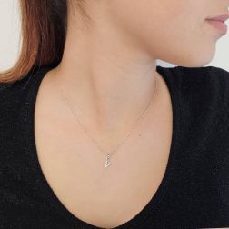 Photo of worn Initial Letter "V" Pendant with Diamonds in 18kt White Gold