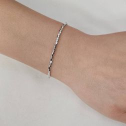 Photo of worn Bracelet/Anklet Octagonal faceted tubes in white gold.