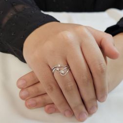 Photo of worn Trilogy in White Gold and Diamonds with three intertwined threads