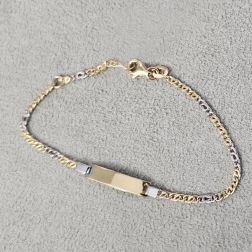 Photo of worn Bicolor Baby 2mm partridge & tigre bracelet with 3.90mm tag