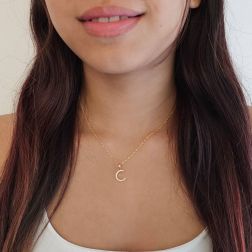 Photo of worn Initial Letter "C" Pendant with Zircon in Yellow Gold