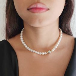 Photo of worn Akoya Pearl Necklace with Sphere Clasp and 9 Emeralds