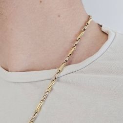 Photo of worn Yellow and White Gold Spiral Tubular 60cm Necklace