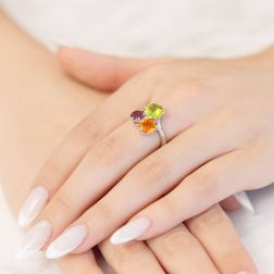 Photo of worn Fancy Ring, Peridot Topaz and Rhodolite in Platinum