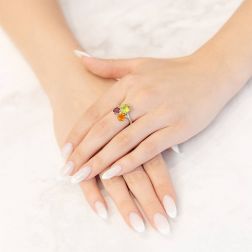 Photo of worn Fancy Ring, Peridot Topaz and Rhodolite in Platinum