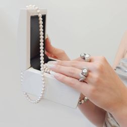 Photo of worn Contrariè Tahitian and Australian Pearl ring with Diamonds