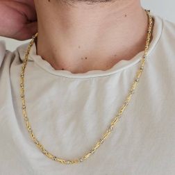 Photo of worn 60cm Tubular Partridge Eye necklace in alternate Yellow Gold with 2 beads in White