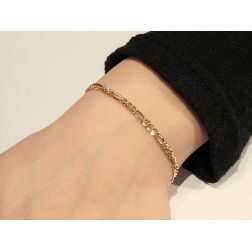 Photo of worn 3.20mm Figaro yellow gold bracelet
