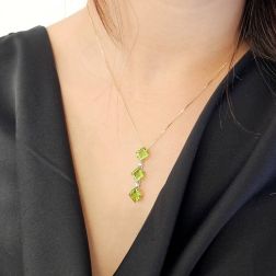 Photo of worn Trilogy Peridot Carré and Diamond on Venetian Necklace