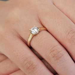 Photo of worn Oval Solitaire Ring with Round Zircon in yellow gold